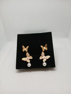 Aretes Mariposa Acero Dorado con Perla