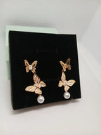Aretes Mariposa Acero Dorado con Perla